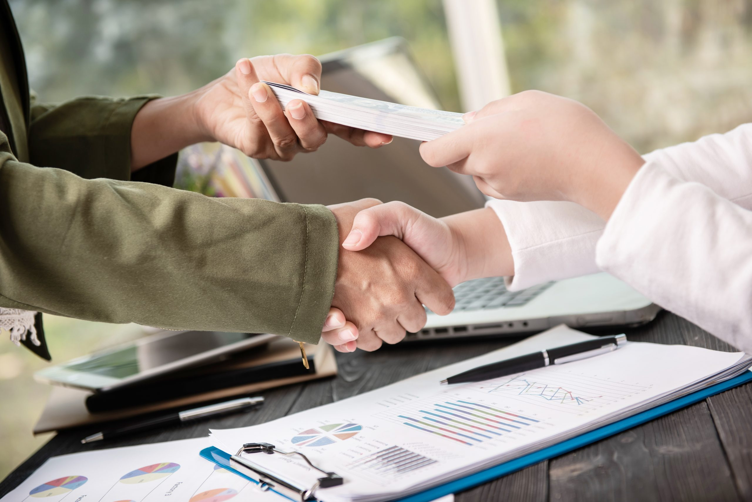 Business people shaking hands, finishing up meeting. businessman